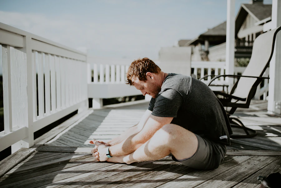 Person practicing a gentle morning mobility routine on a sunlit porch
