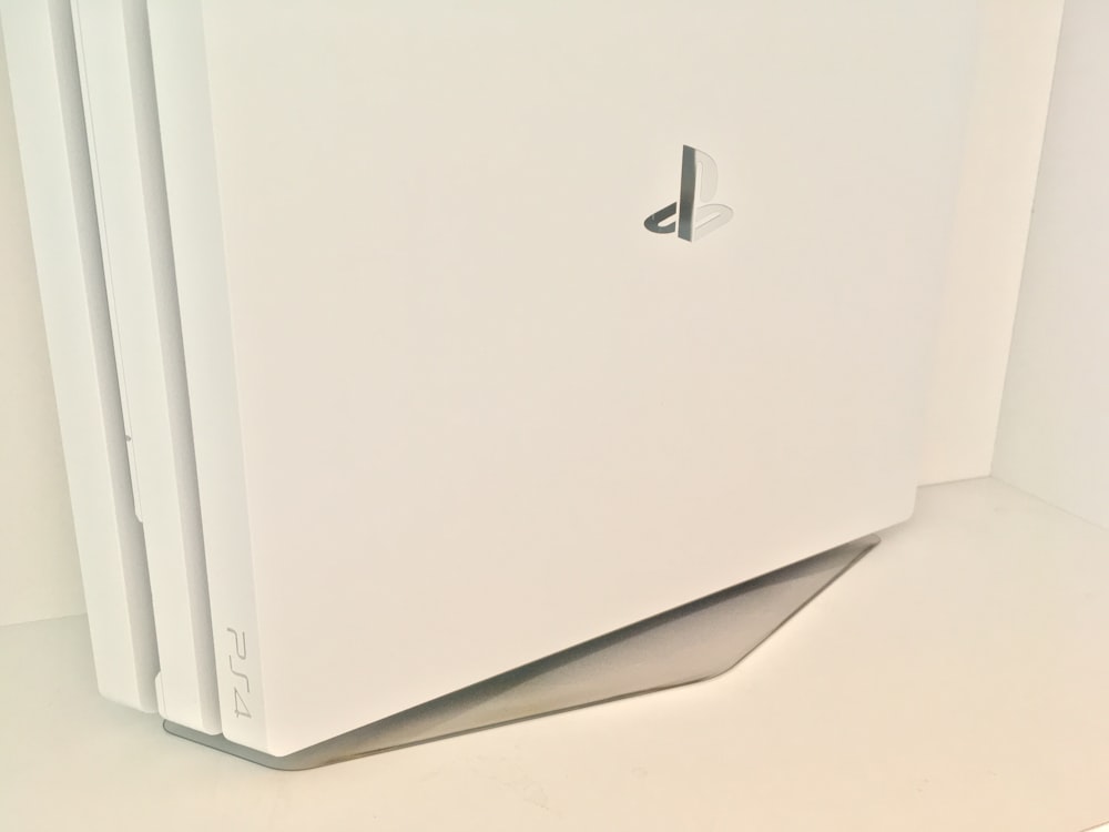 white Sony PS4 Pro game console