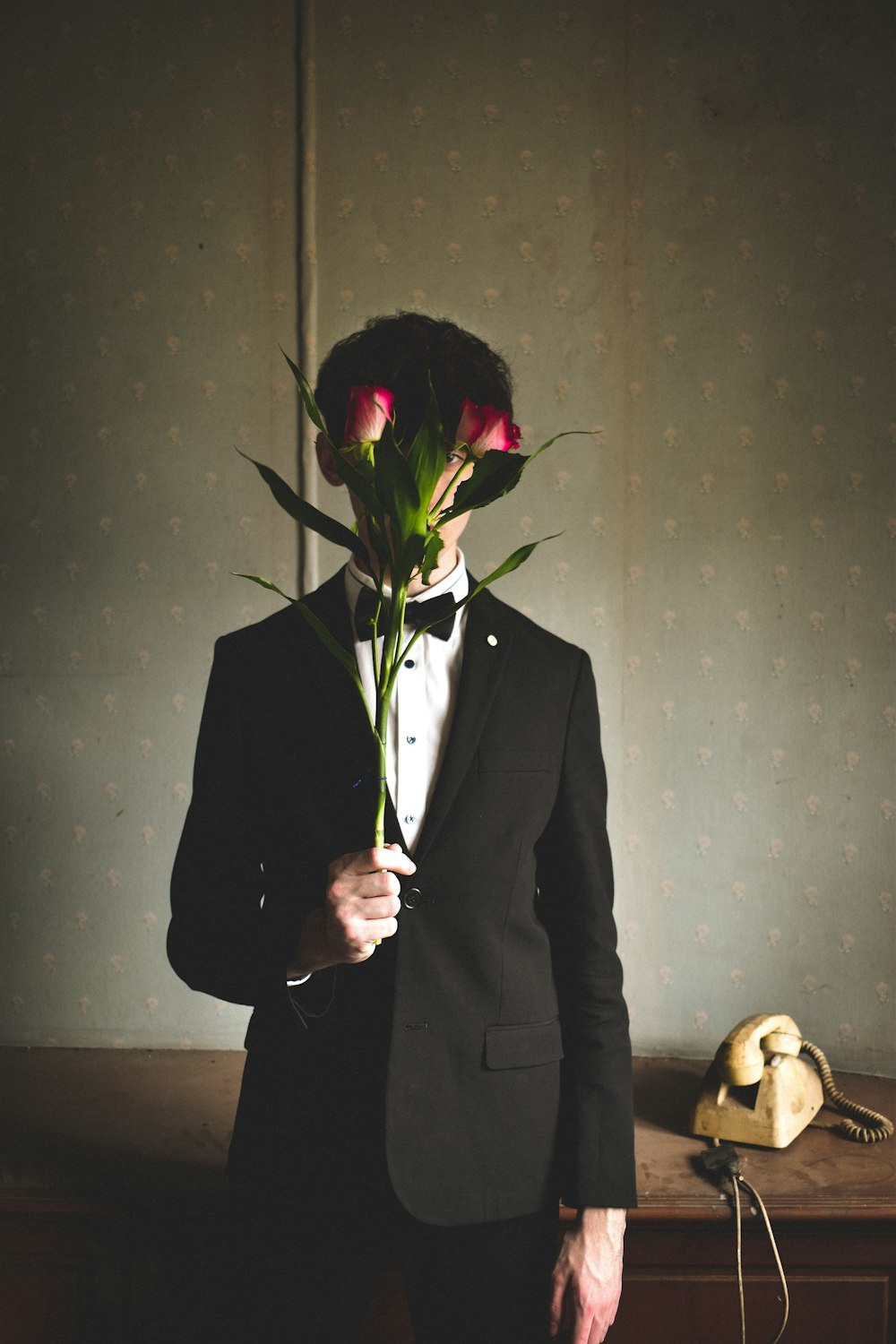 man holding red rose