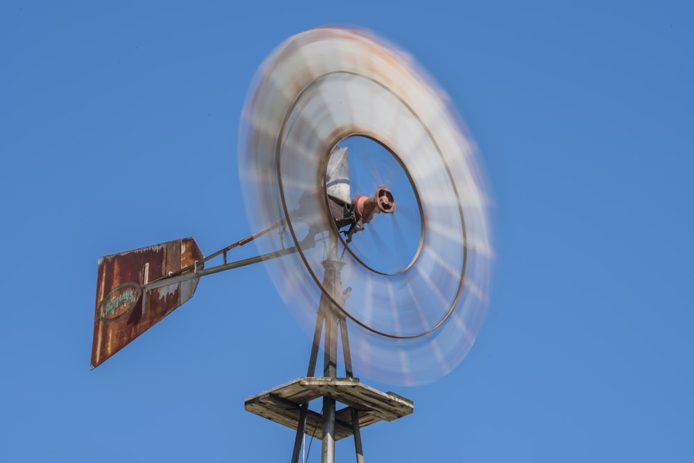 brown wind mill under blue sky