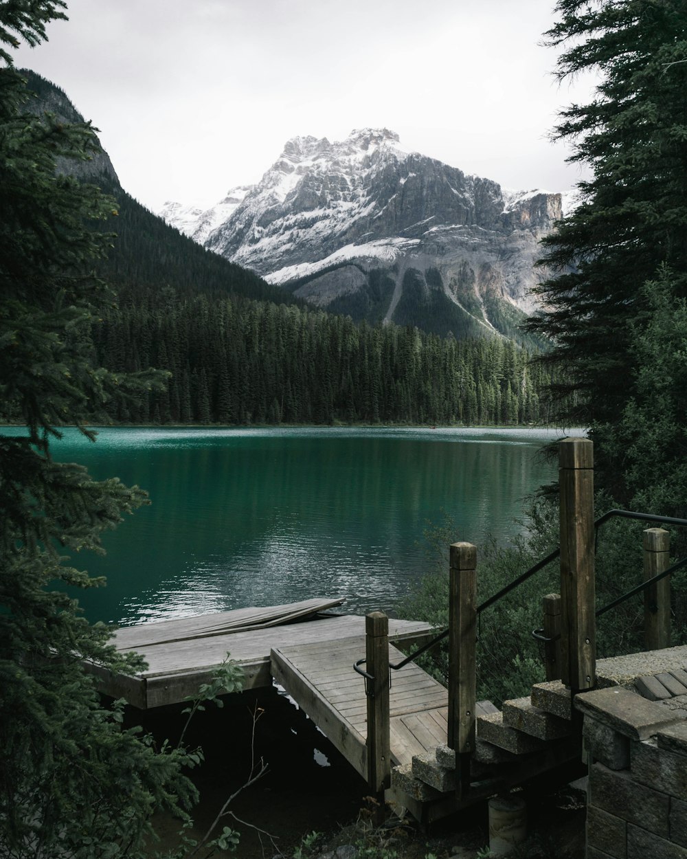 wooden dock near body of water during daytime