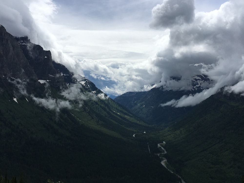 aerial view of clouds covering mountain