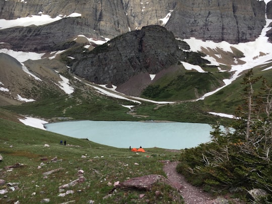 landscape photography of body of water near mountains in Cracker Lake United States