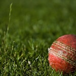 shallow focus photography of red cricket ball