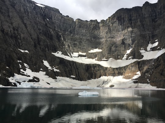 photo of body of water near mountain in Iceberg Lake United States