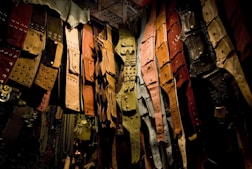 assorted-color leather belt lot being displayed