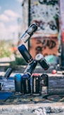 selective focus photo of flying spray paint cans o
