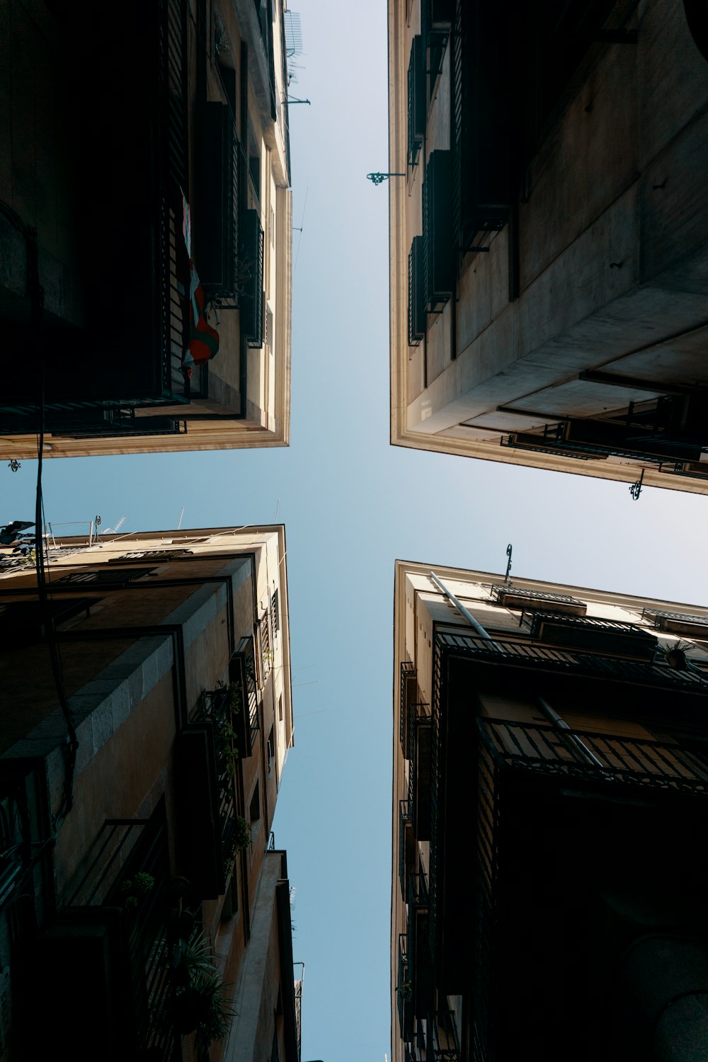 four buildings under clear sky during daytime