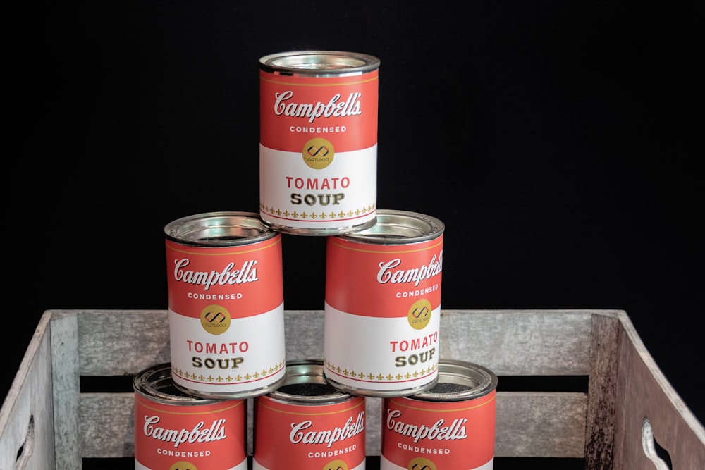 pile up of Campbell's tomato soup cans