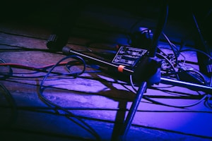 low-light photo of black microphone stand