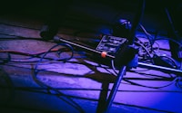 low-light photo of black microphone stand