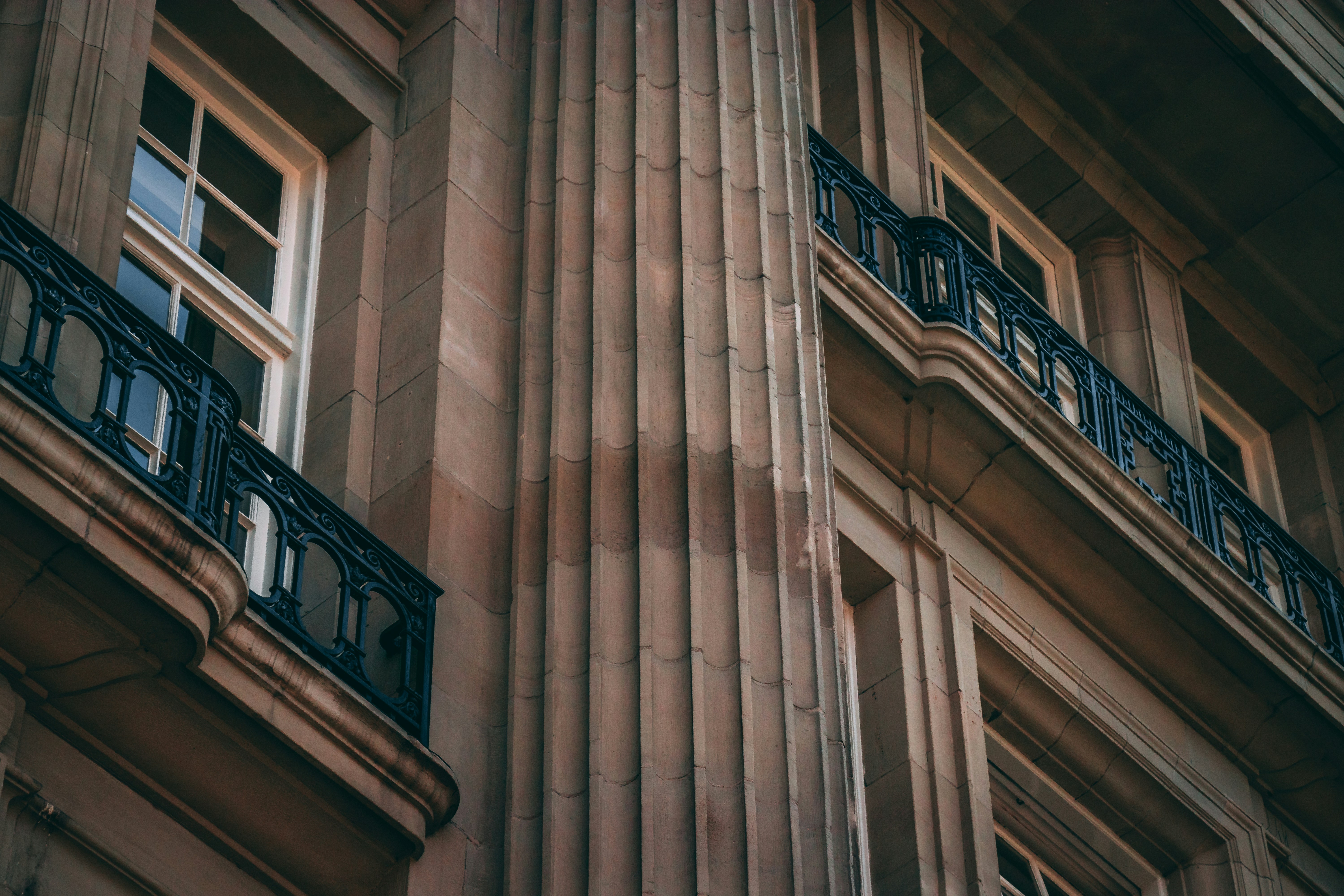 low angle photo of beige concrete building