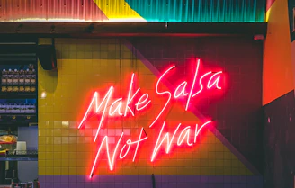 make salsa not war LED signage turned-on