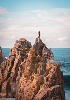 man standing on cliff