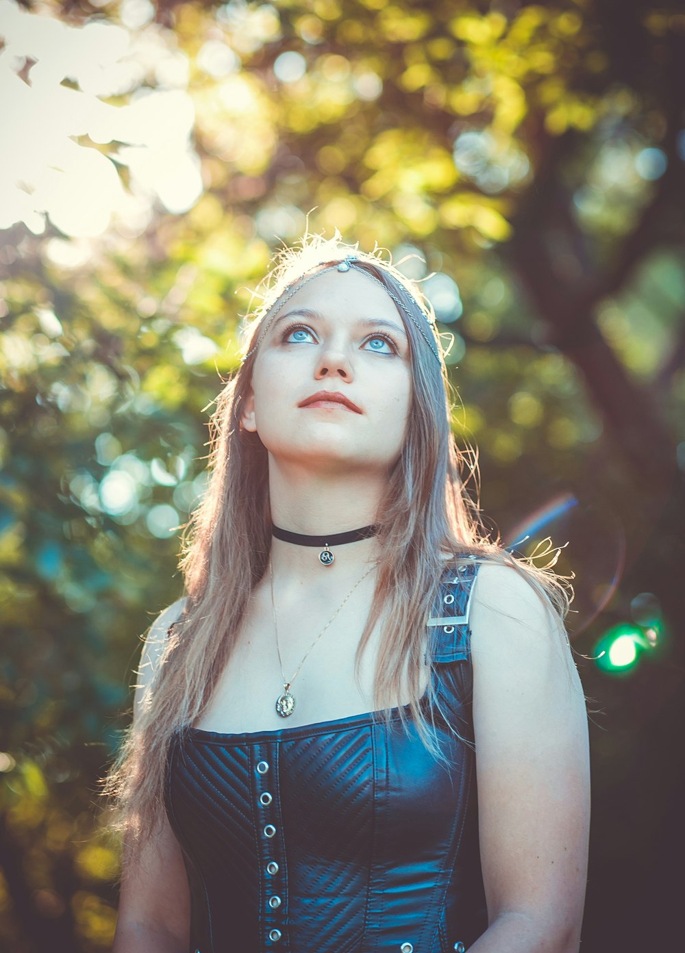 shallow focus photography of woman in black leather sleeveless top