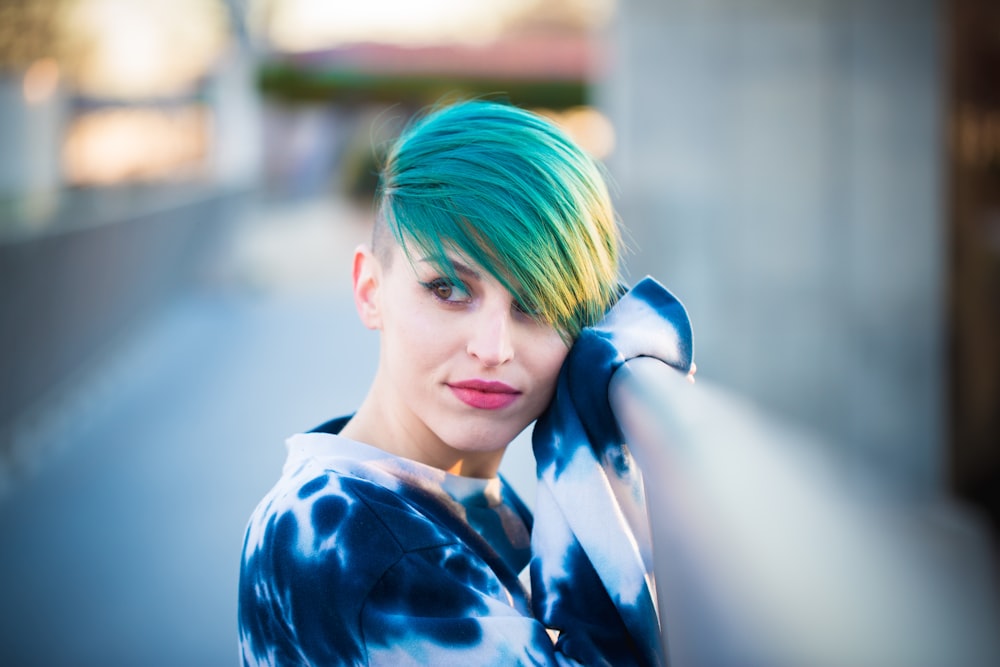 focused photo of woman in long-sleeved shirt