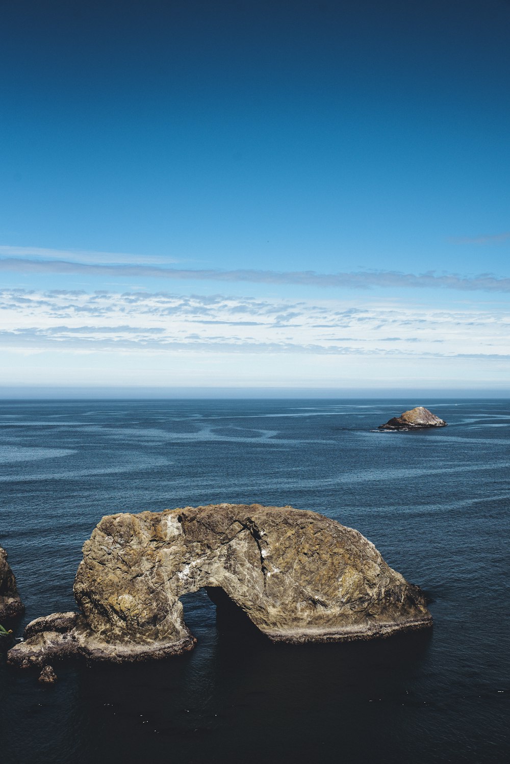 rock formation on body of water