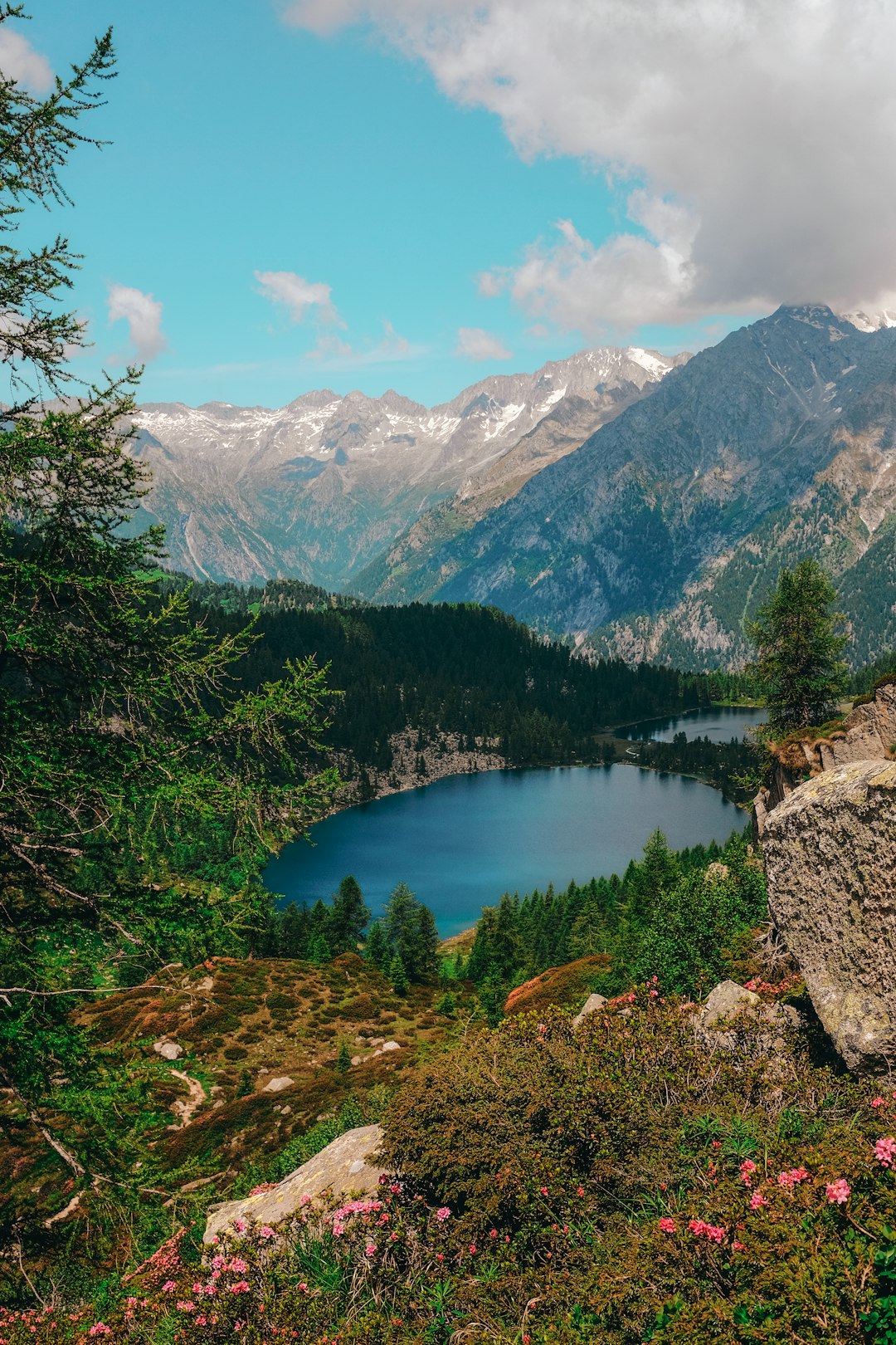 body of water surrounded by mountain range