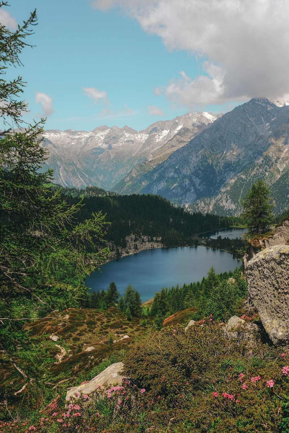 body of water surrounded by mountain range