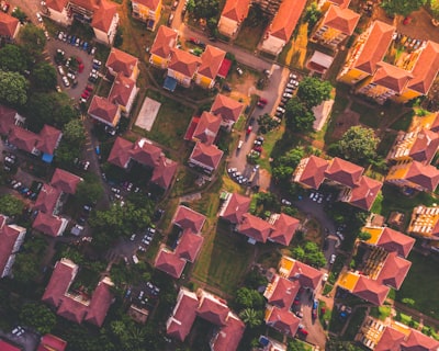 bird's eye photography of red and orange houses housing teams background