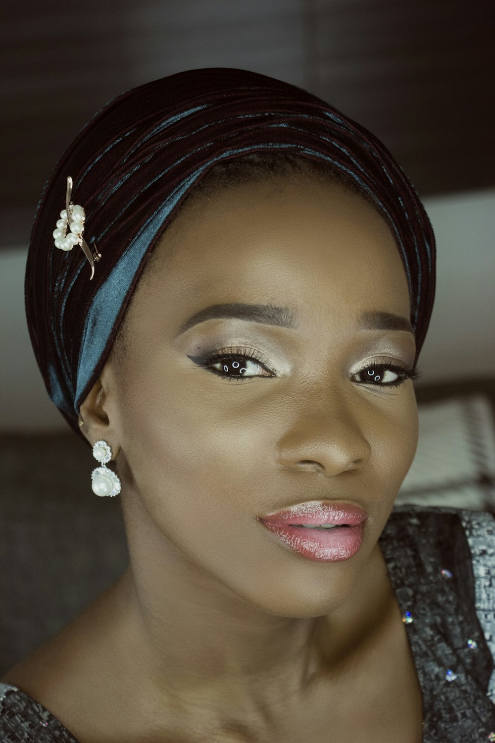 selective focus photo of woman with blue headscarf