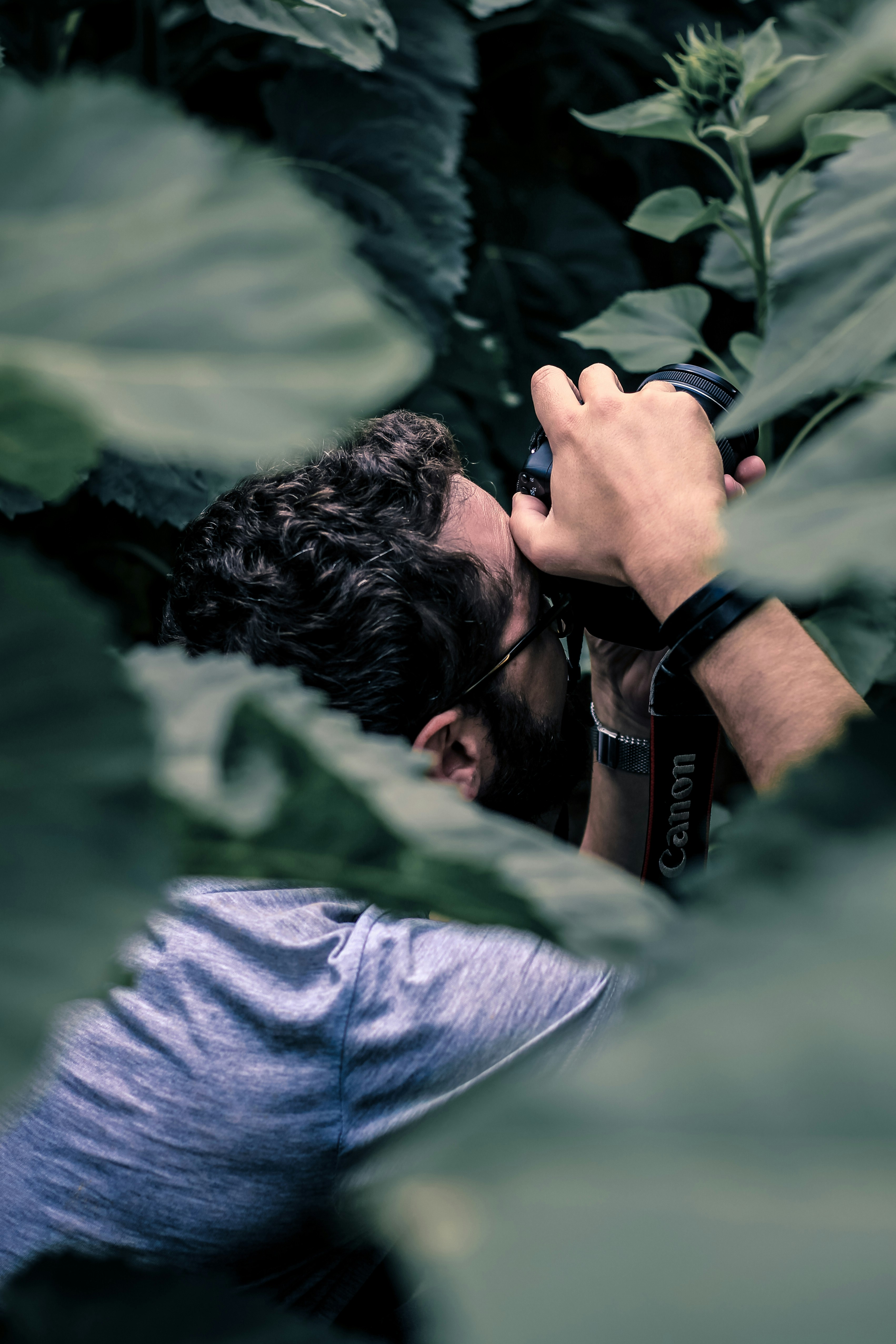 man taking photo using DSLR camera