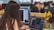 A person with long hair is working at a computer in a modern office environment. The desk is equipped with multiple monitors, and a laptop is displaying design software. Bright yellow and purple flowers are placed on the desk, adding a cheerful touch. Other workers can be seen in the background, focused on their tasks.