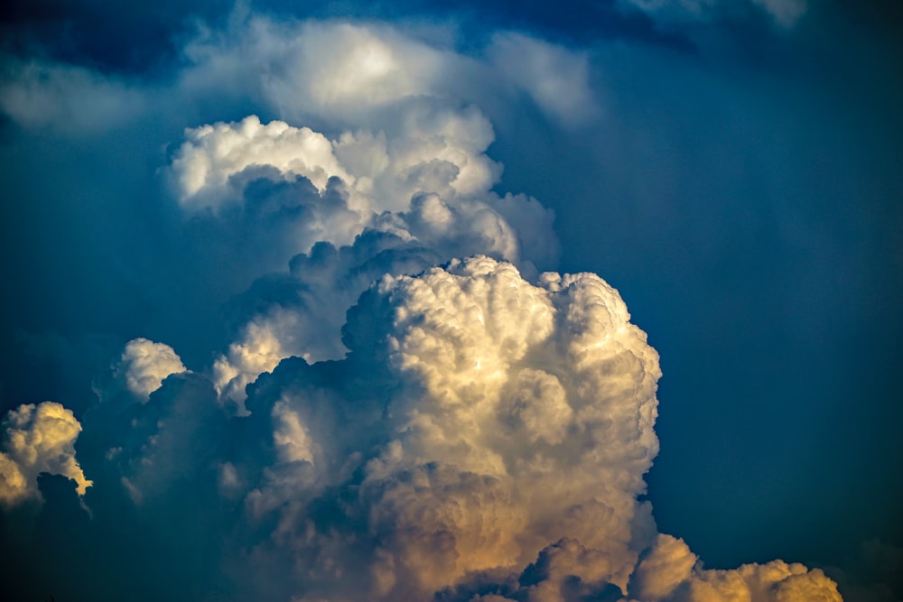 white cumulus clouds on blue sky