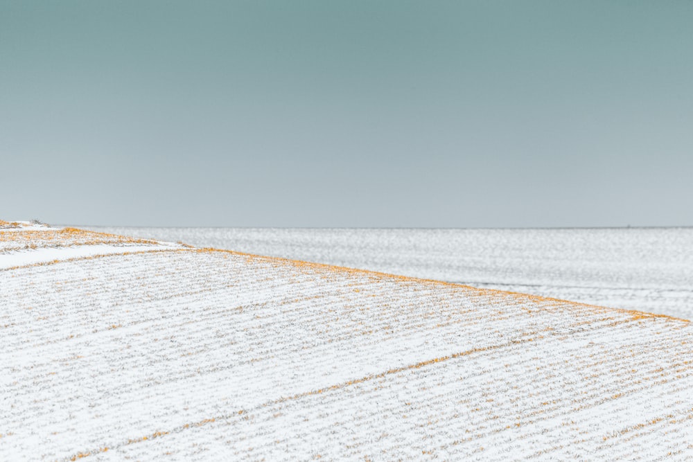 a person walking on a snow covered field