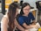 two women sitting beside table