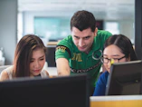 two women and one man on computer screen
