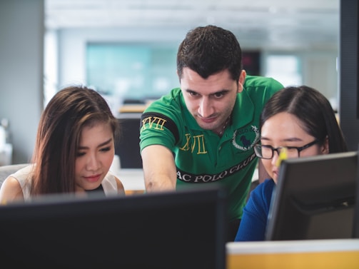 two women and one man on computer screen