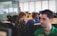 A diverse team collaborating in a modern office environment, focused on problem-solving and communication.