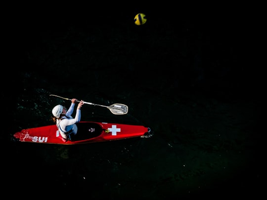 person on boat with paddle in Zürich Switzerland