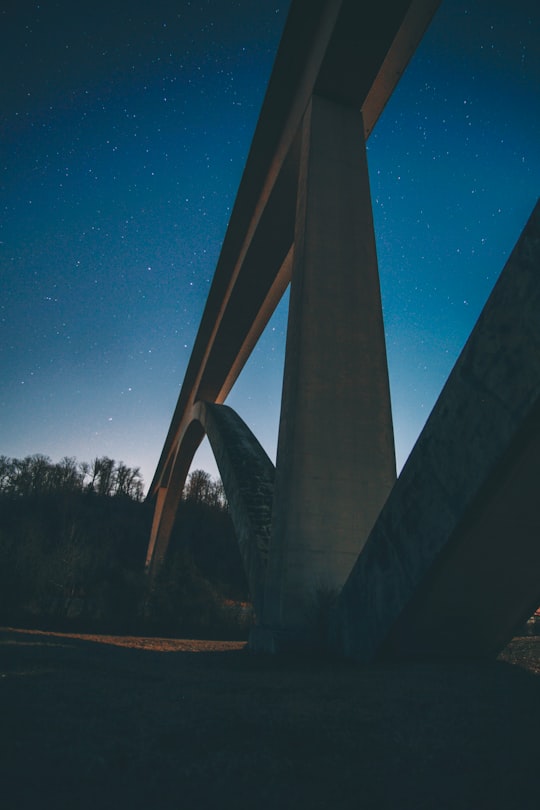close-up photography of concrete suspension bridge during nighttime in Franklin United States