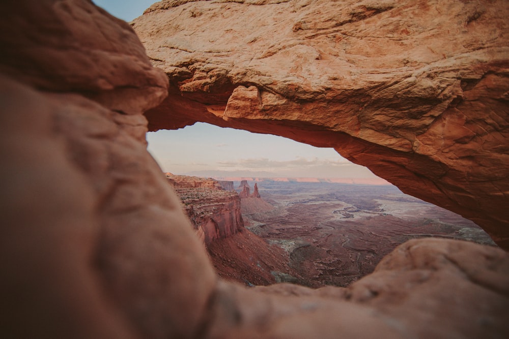 a rock formation with a hole in the middle of it