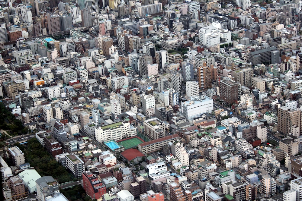 aerial photo of assorted-color concrete city high rise buildings