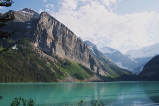 Photo of a travel destination with mountains and a lake.