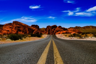 empty blacktop road during daytime
