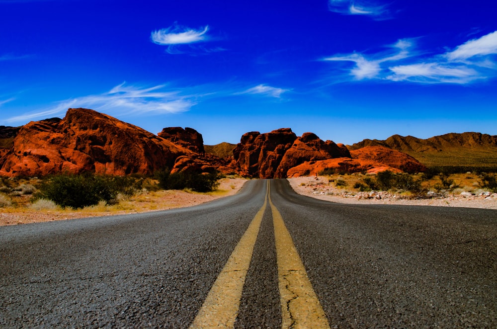 empty blacktop road during daytime