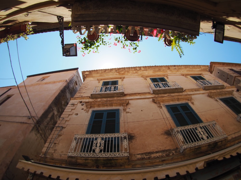 low angle photography of brown building during daytime