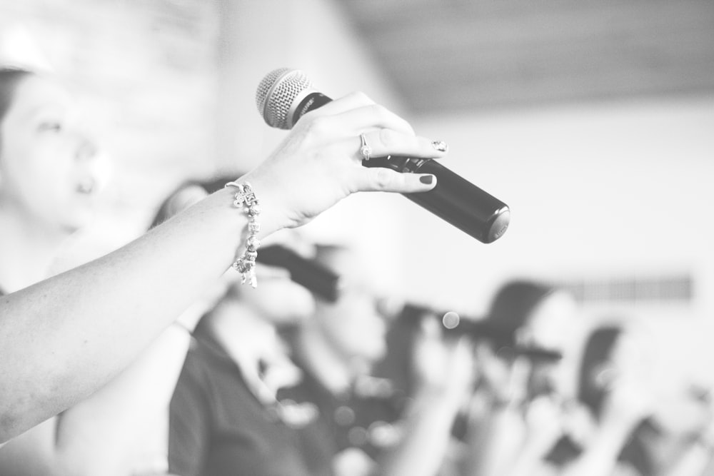 person holding microphone