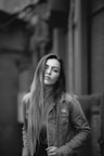 grey scale photo of woman in jacket