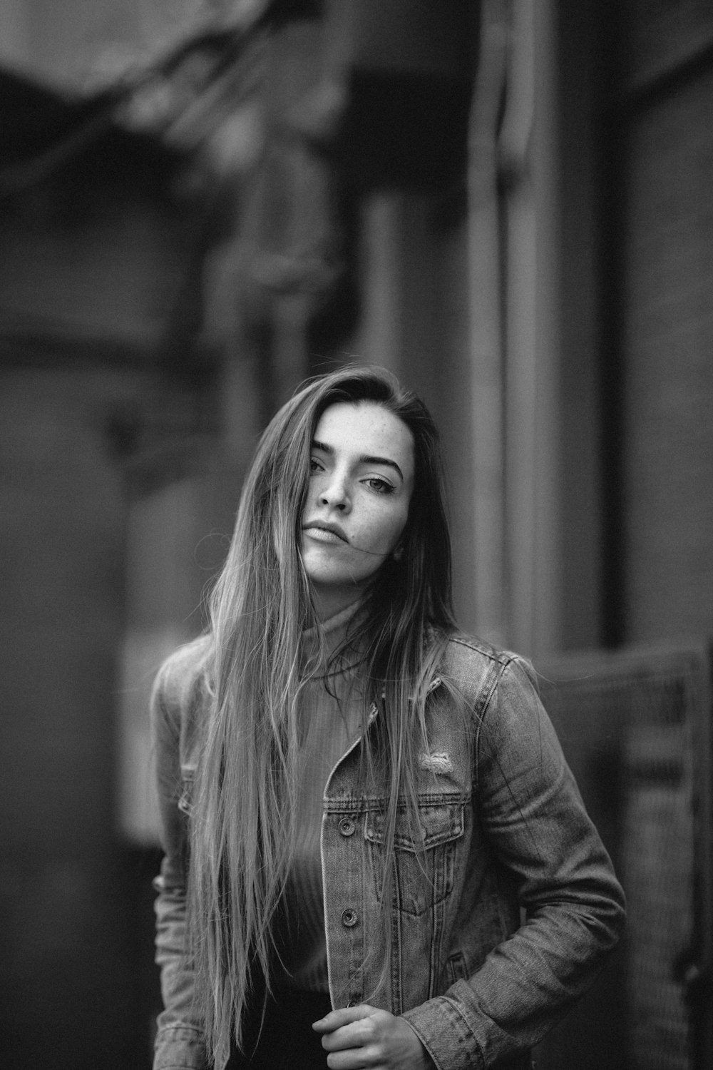 grey scale photo of woman in jacket