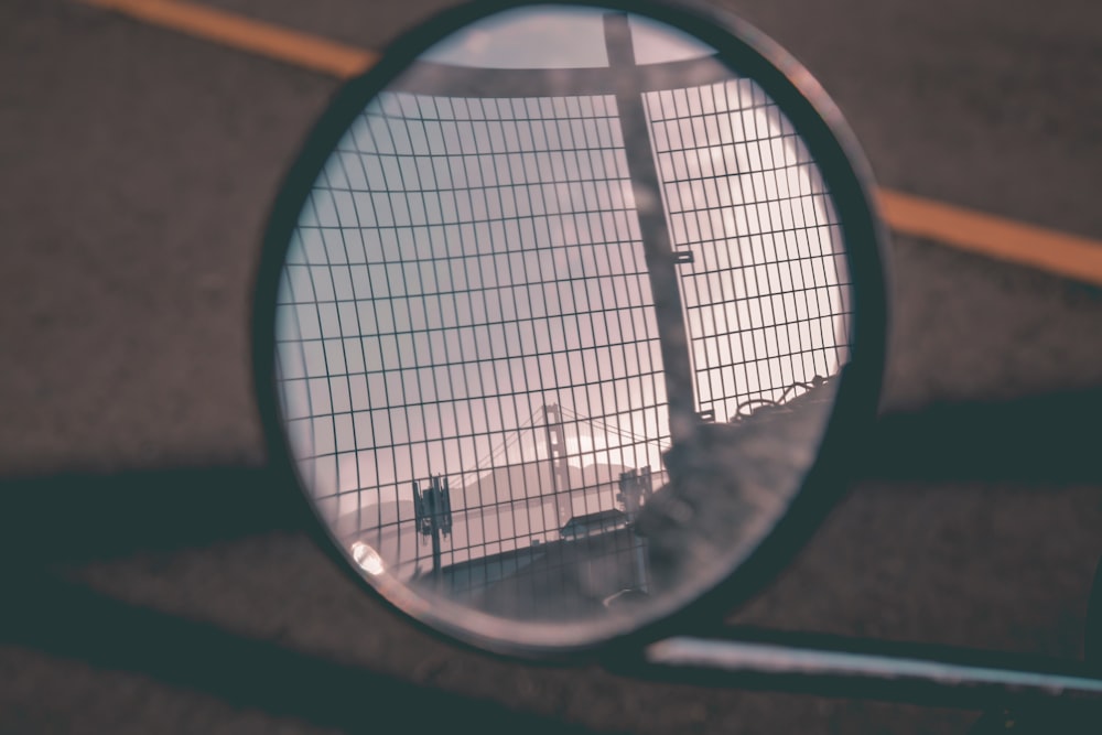 photo of round black framed motorcycle side mirror