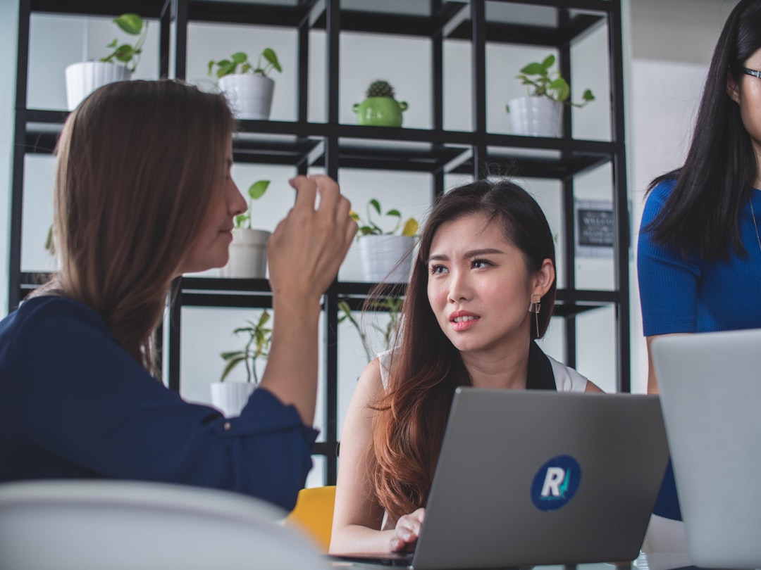 woman sitting in front of laptop,