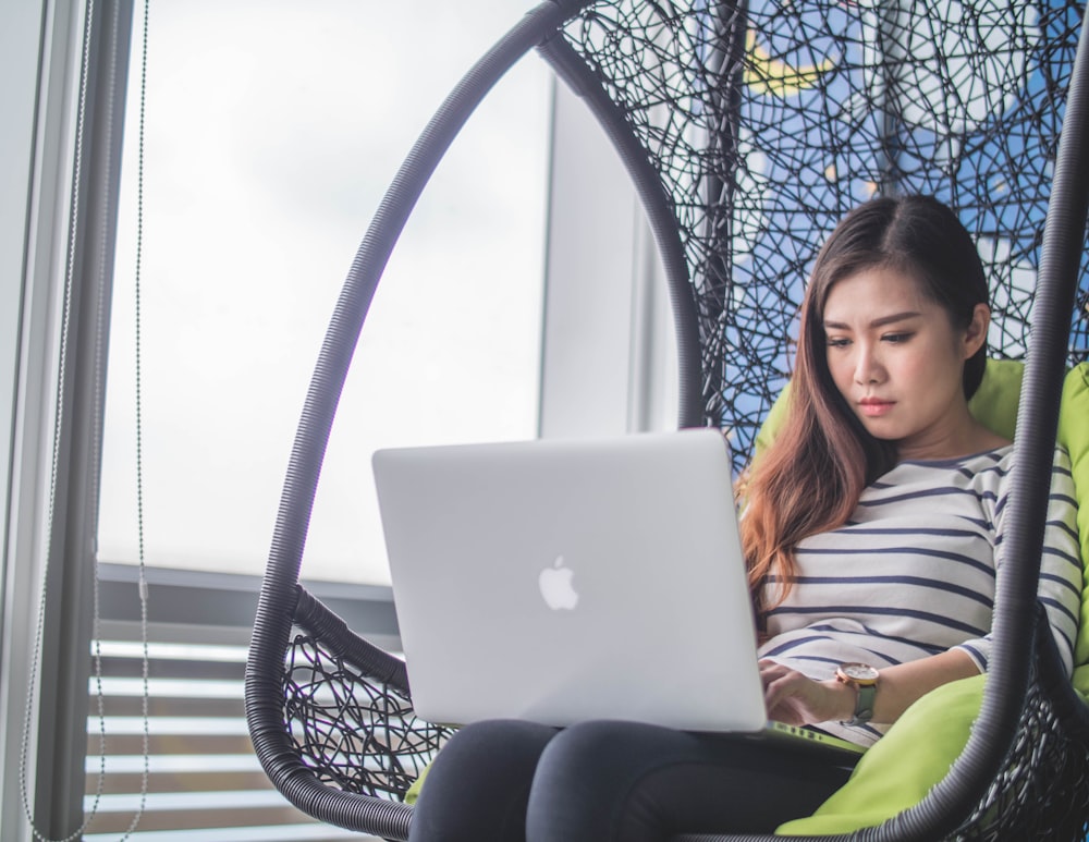 MacBook on woman's lap