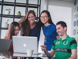 A group of happy people enjoying fast internet together.