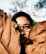 person hiding in brown leafed decors