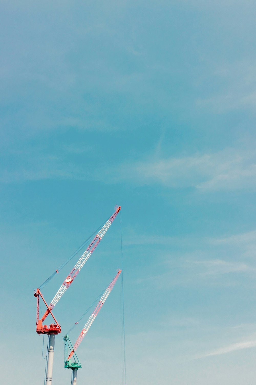 red and green steel cranes during daytime